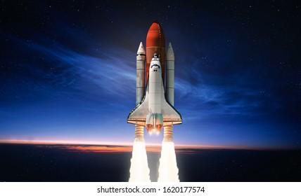 Space shuttle launch in the open space over the Earth. Sky and clouds under space ship. Elements of this image furnished by NASA
