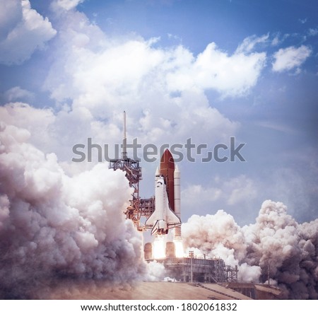Space shuttle launches from spaceport. Elements of this image furnished by NASA