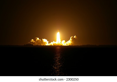 Space Shuttle Night Launch. STS-116 Discovery launching from Cape Kennedy. - Powered by Shutterstock
