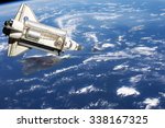 Space Shuttle orbiting the earth. Elements of this image furnished by NASA.