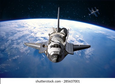 Space Shuttle orbiting the earth. Elements of this image furnished by NASA. - Powered by Shutterstock