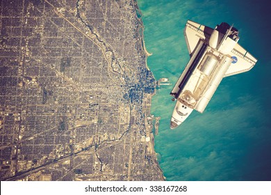 Space Shuttle orbiting the earth. Elements of this image furnished by NASA.vintage color - Powered by Shutterstock