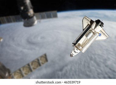 Space Shuttle orbiting the earth. Elements of this image furnished by NASA.
