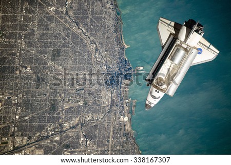 Space Shuttle orbiting the earth. Elements of this image furnished by NASA.