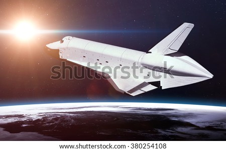 Space Shuttle Orbiting Earth. Elements of this image furnished by NASA