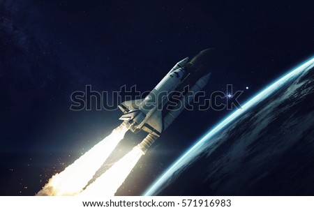 Space shuttle orbiting Earth planet. Elements of this image furnished by NASA