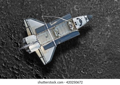 Space Shuttle orbiting the moon. Elements of this image furnished by NASA. - Powered by Shutterstock