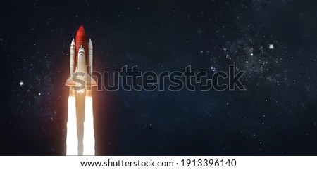 Space shuttle in outer space on dark background. Rocket with astronauts. Elements of this image furnished by NASA