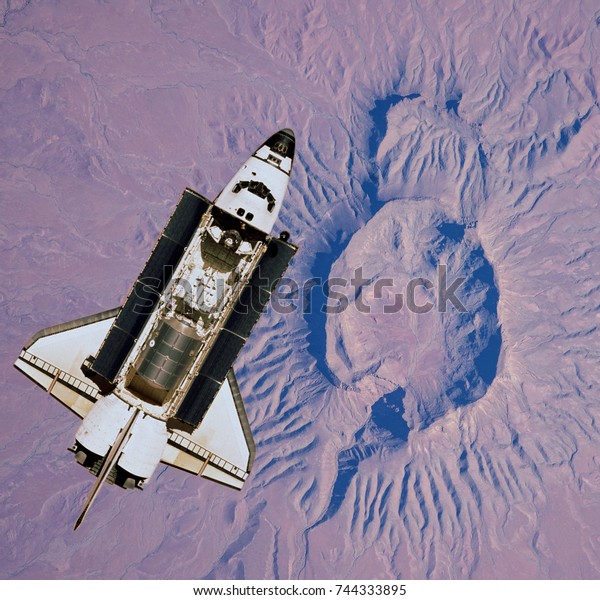 Space shuttle over Mars surface,\
Mars planet. Elements of this image furnished by\
NASA.\
