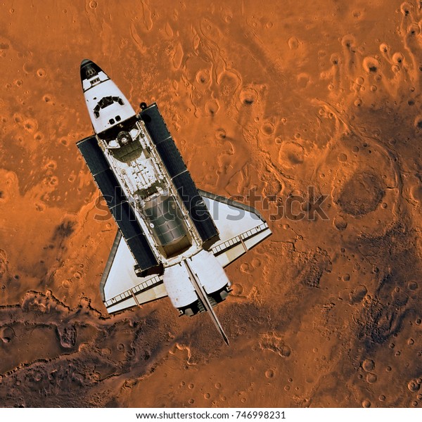 Space shuttle over Mars surface,\
Mars planet. Elements of this image furnished by\
NASA.\
