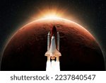 Space shuttle rocket with blast takes off to the red planet mars with dawn rays light. Successful launch of the spacecraft. Space mission to mars, creative