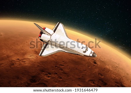 Space shuttle rocket is flying to the red planet Mars into outer space. Spacecraft performs a mission, journey and explores a new planet.