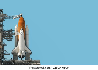 Space shuttle rocket isolated on blue cyan background with copy space. Elements of this image furnished by NASA. - Powered by Shutterstock