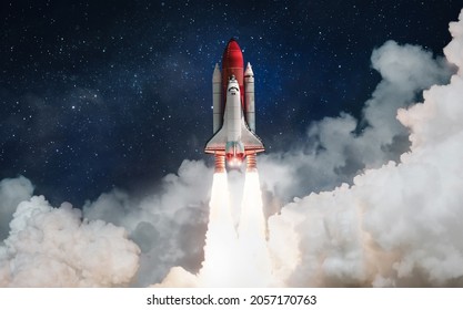 Space shuttle rocket launch in the clouds with stars to outer space. Space on background. Sky and clouds. Spaceship flight. Elements of this image furnished by NASA - Powered by Shutterstock