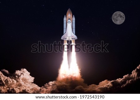 The space shuttle rockets launch into space , Month