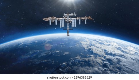 Space station on orbit of Earth planet. Blue planet and ISS in deep space. Elements of this image furnished by NASA - Shutterstock ID 2296383629