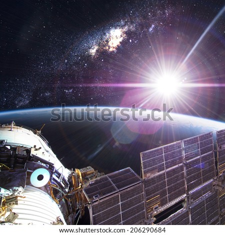 Space Station Orbiting Earth. Elements of this image furnished by NASA