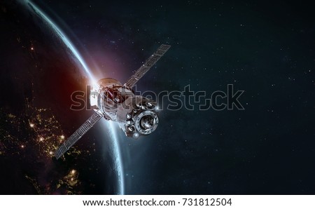 Space station and space ship in the outer space. Earth sunshine on the background. Elements of this image furnished by NASA