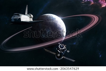 Space station and shuttle on background of deep space planet. Science fiction. Elements of this image furnished by NASA