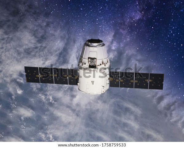 Space vehicle capsule orbiting the earth orbit\
cosmos. Preparing of docking into space station. Elements of this\
image furnished by NASA.