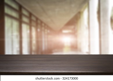 Space Of Wood Table Platform And Atmosphere Around Office Blur Background For Product Presentation.