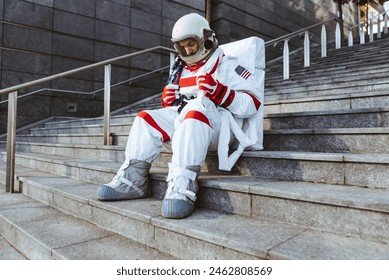 spaceman in a futuristic station. Man with space suit walking in an urban area - Powered by Shutterstock