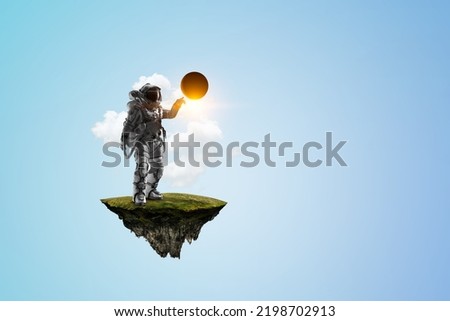 Spaceman on a light bulb
