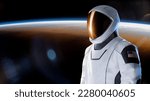 Spaceman in outer space on Earth planet background. Exploration theme. Elements of this image furnished by NASA.