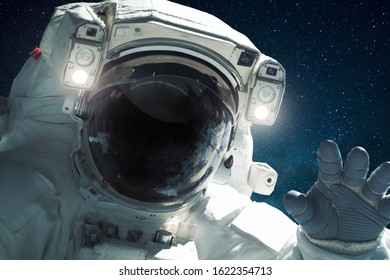 Spaceman in outer space. Welcome to space. Astronaut close up
