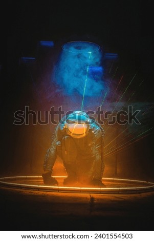 Spaceman or star trooper in the helmet in dark teleporting through the portal concept. Science fiction concept. Outer space travel.