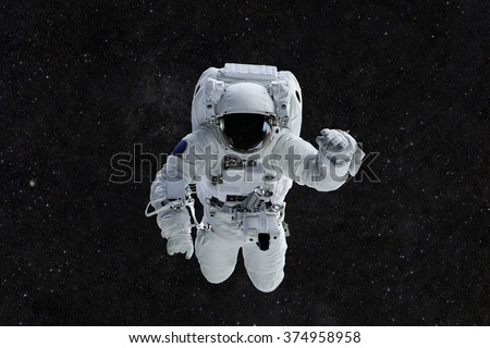 Spaceman travels on a background of stars. Astronaut outer space