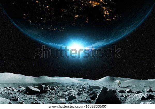 Spaceman walks on the\
moon against the background of the planet. Beautiful moon with\
planet Earth on a background of stars in outer space. Astronaut\
travels on an asteroid