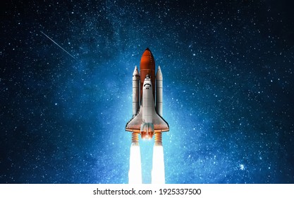 Spaceship in deep space. Starry sky and blue galactics. View on space shuttle and milky way. Elements of this image furnished by NASA