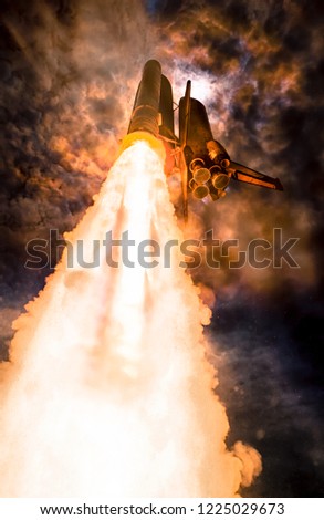 Spaceship launch at night, low-angle perspective. The elements of this image furnished by NASA.