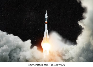 Spaceship launches into space. Rocket takes off against the background of the starry sky. Rocket liftoff.