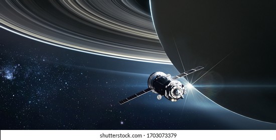 Spaceship on orbit of the Saturn planet. Exploration of the space. Rings of the planet. Sci-fi wallaper. Elements of this image furnished by NASA