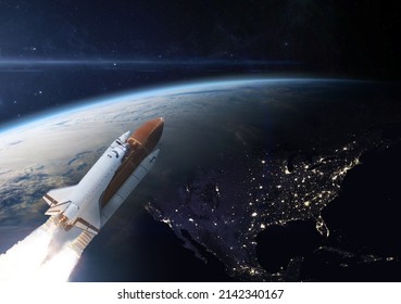 Spaceship in the outer space on orbit of Earth planet. North America at night viewed from space with city lights in Canada, USA, Mexico, Cuba. Elements of this image are furnished by NASA