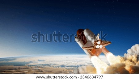 Spaceship takes off into the night sky on a mission. Elements of this image furnished by NASA