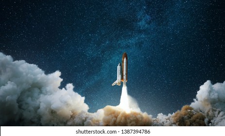Spaceship takes off into the starry sky. Rocket starts into space. Concept