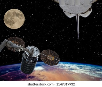 Spaceships and moon. The elements of this image furnished by NASA.