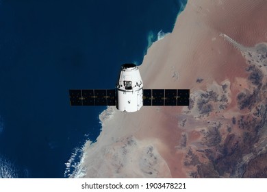 SpaceX Dragon resupply ship is pictured approaching the International Space Station. Elements of this image furnished by NASA.