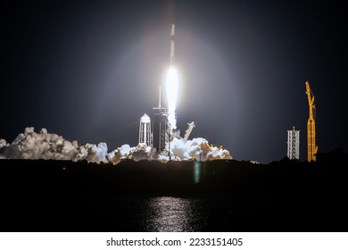 SpaceX rocket Falcon 9 rocket  capsule soars upward after lifting off from launch pad. Digitally enhanced. Elements of this image furnished by NASA. - Shutterstock ID 2233151405