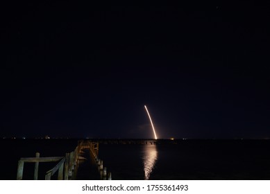 SpaceX Solid Rocket Booster Returning To Earth At Night