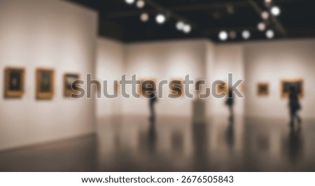 A spacious art gallery interior, showcasing paintings and visitors exploring the space.