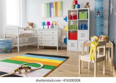 Spacious Baby Room With Minimalistic Furniture, Toys And Colorful Decorations