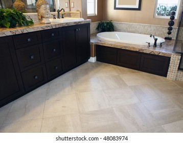 Spacious Bathroom Floor With A Modern Tub.