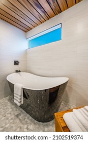 Spacious Bathroom With Tub And Shower In Enclosure Glass Walls Black Bathtub Tiger Wood Accents Decorative Tile And Mosaic Floor Tile