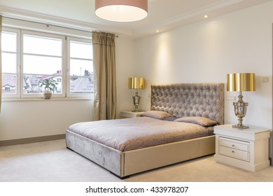 Spacious Bedroom In Beige With Big Upholstered Bed