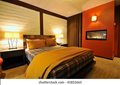 Spacious Boutique Hotel Room With Fireplace And Bed