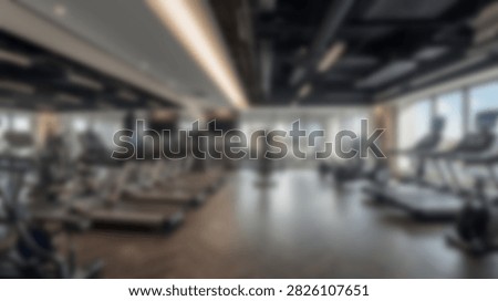 Spacious and bright gym interior featuring rows of treadmills and large windows allowing natural light.